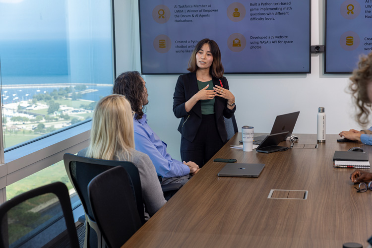 UWM data science major Khatera Nazari gives a presentation at Northwestern Mutual, where she worked as an intern.