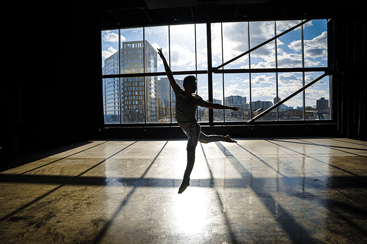 A dance student rehearsing in one of the dance studios on campus