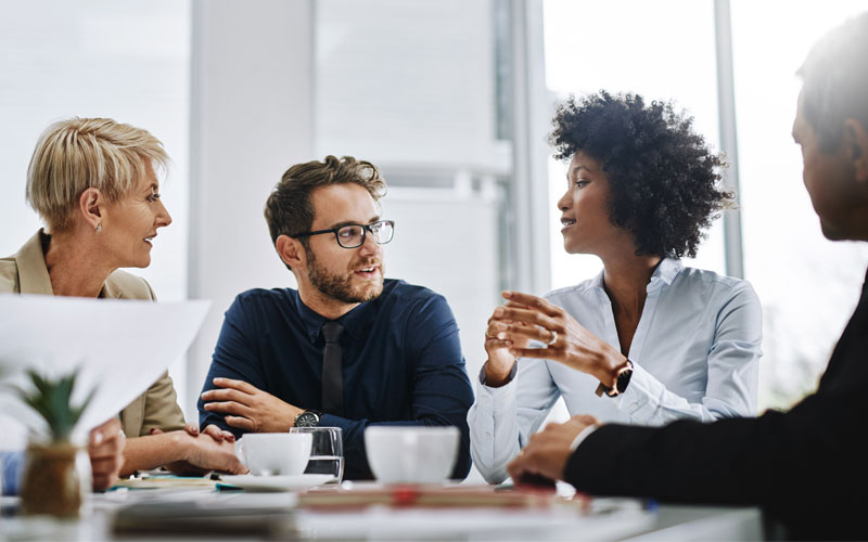 Young professionals collaborating in a conference room.