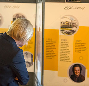 The Oct. 1 event was held at the Chancellor’s residence, one of a number of buildings the Foundation’s Real Estate arm has helped the university purchase. Here a guest looks over a display on Foundation history.
