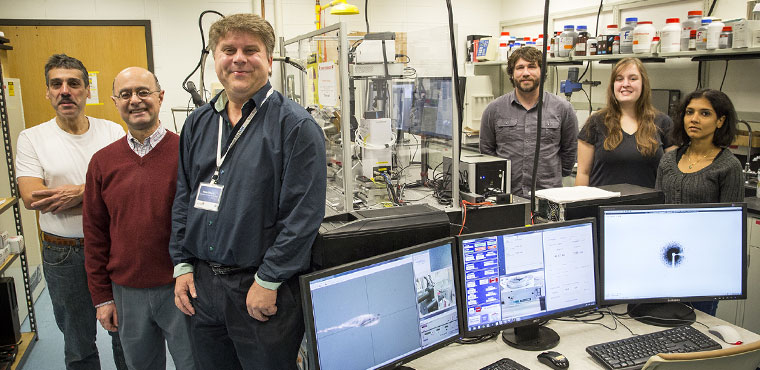 Members of the UWM physics team working on the protein imaging project at the Stanford XFEL include (from left), Associate Professor Peter Schwander, Distinguished Professor Abbas Ourmazd, Professor Marius Schmidt, and doctoral student Jason Tenboer, intern Jennifer Scales and graduate student. (Photo by Troye Fox)