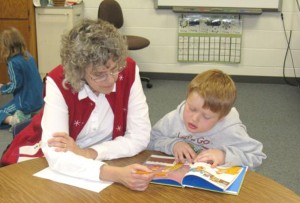 One of the school districts that has brought the UWM Early Reading Empowerment methods to its classrooms is Rhinelander. This photo, from 2010, shows a teacher working with a young reader.
