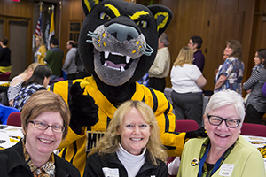Pounce Panther joins Julie Frey, left, winner of the Unsung Hero award, Anne Banda and Amy Coenen, who was nominated for an Outstanding Performance award. All three work in the College of Nursing. (UWM Photo/Derek Rickert)