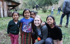 Cassandra Bence smiles with four young Guatemalan girls while working in Guatemala with Engineers Without Borders.