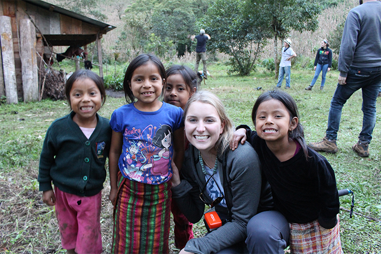 Cassandra Bence smiles with four young Guatemalan girls while working in Guatemala with Engineers Without Borders.