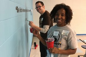 Patricia Patterson (BS '86 Criminal Justice) and Dave Steele (MUP '04) were among the UWM alums helping out on Martin Luther King Jr. Day of Service. (Cindy Petrites photo)