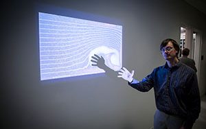 Tom Hansen demonstrates computational fluid dynamics software he developed to show the interactions of users with the flow fields.