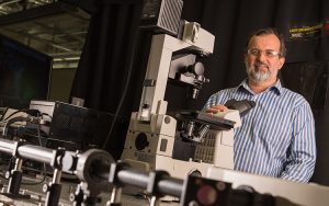 Valerica Raicu with his multiphoton microscope.