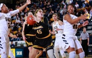 Lizzie Odegard battles against UNC-Greensboro in the WBI semifinals Thursday night. UWM lost 59-49. (Photo by Carlos Moralas)