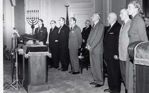 Dignitaries at the opening ceremony for the new UWM in October 1956 at Temple Emanu-El B'ne Jeshurun include (from left) Albert Davis, aide to Milwaukee Mayor Frank Zeidler; William D. McIntyre, president of the Board of Regents of State Colleges; Charles D. Gelatt, president of the University Board of Regents; Wisconsin Gov. Walter J. Kohler; provost J. Martin Klotsche; Edwin B. Fred, president of the University of Wisconsin; Donald Rambadt, UWM student government president; and Helen Rehlsein, student senate president. (UWM archives)