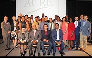 Students and teachers pose for a photo.