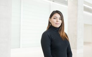 Cinthia Téllez stands in front of the Kenwood Interdisciplinary Research Complex.