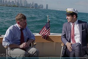 Egan and Kosta ride in a boat with the Chicago skyline in the background.