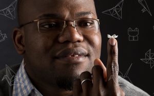 Jian Chen holding a small piece of foldable plastic