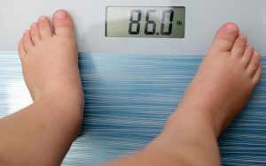 Child's feet on a scale