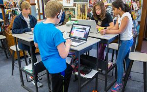 Students working at standing desks