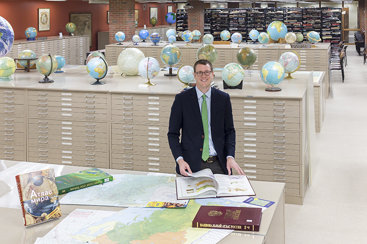 John Reuter stands in the American Geographical Society Library at UWM.