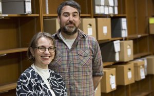 Bonnie Halvorsen and Mike Carriere stand in a room in the UWM Libraries.