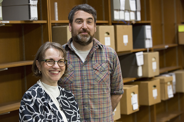 Bonnie Halvorsen and Mike Carriere stand in a room in the UWM Libraries.