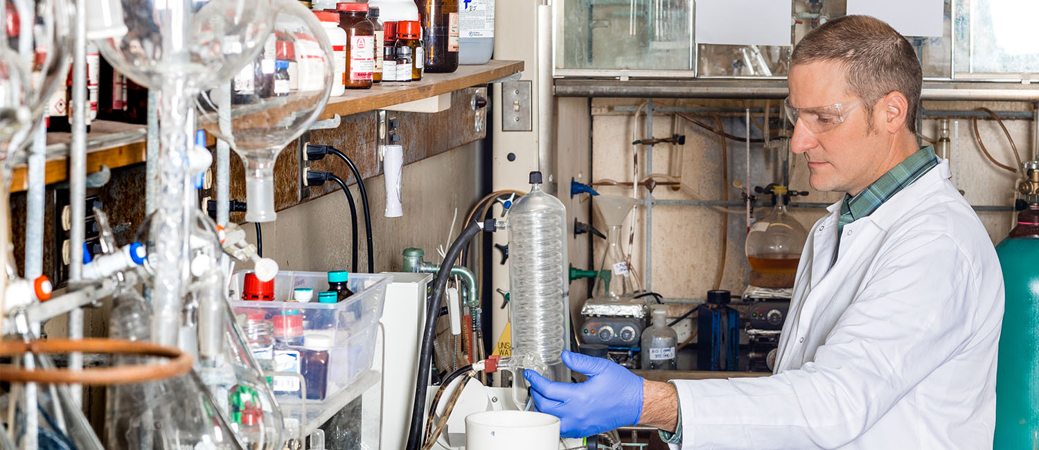 Image of graduate student working in lab