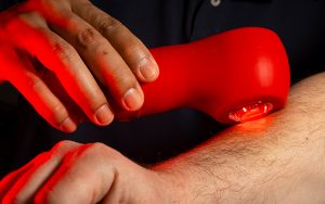 Image of a hand applying light therapy