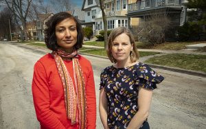 Two women pose stand in a Milwaukee neighborhood.