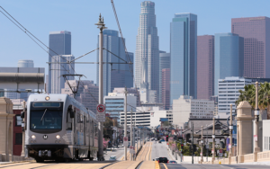 Los Angeles light rail train with downtown in background