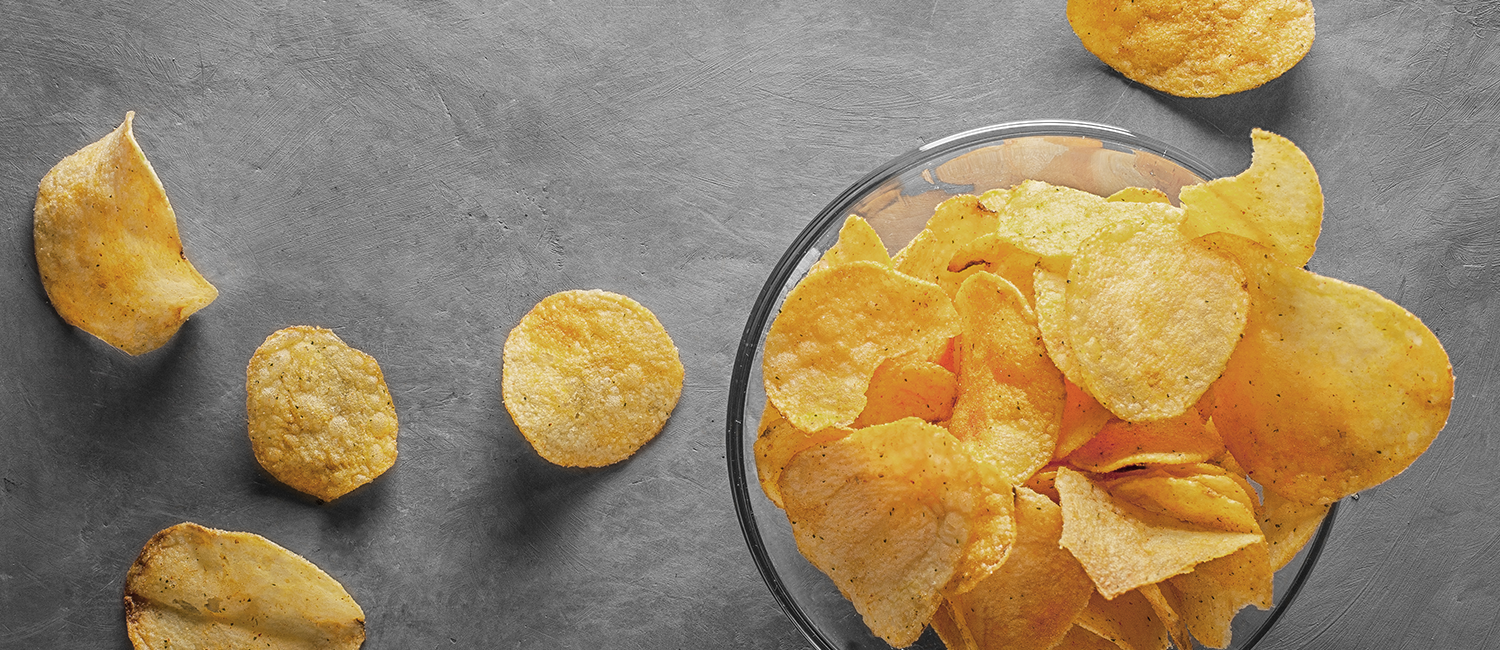 Image of potato chips in a glass bowl
