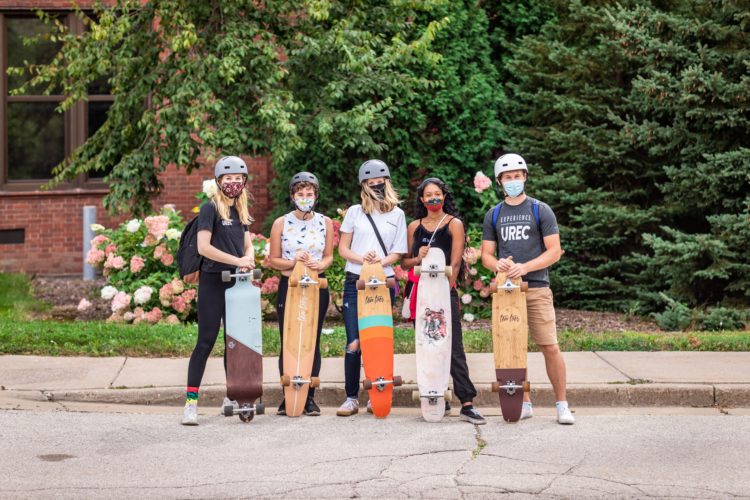students with longboards
