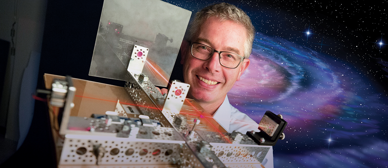 Patrick Brady shows off a model of LIGO