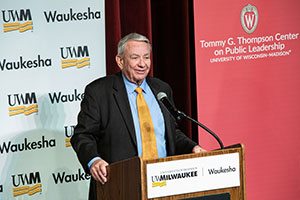 Tommy Thompson speaks at a podium