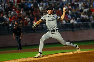 A left handed pitcher throws a baseball from the mound.