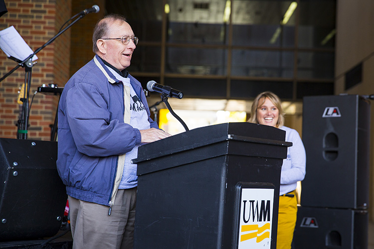 Jim Cheski, who drew the first Panther image adopted as UWM's mascot, addresses the crowd during the dedication of the Panther statue on Nov. 10, 2015 outside Golda Meir Library. (UWM Photo/Derek Rickert)