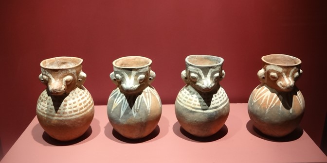 ancient ceramic pots with animal faces