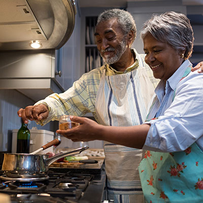 Older couple cooking together