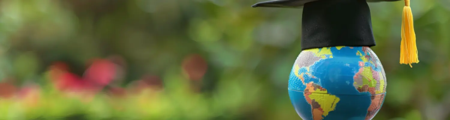 globe with graduation cap and tassel on it