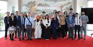 group of people in front of flags