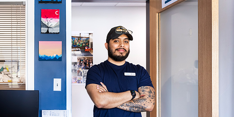 Adult learner standing with arms crossed