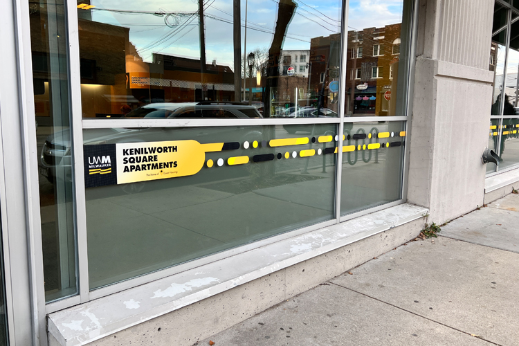 Kenilworth Square Apartment exterior windows with cut vinyl window graphics