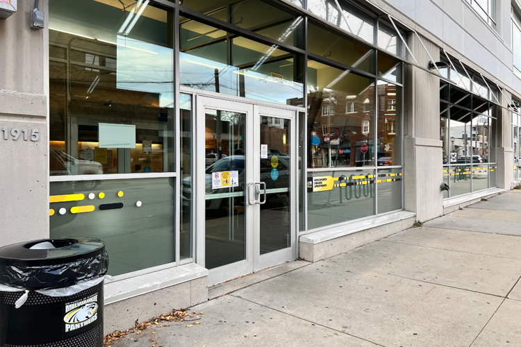 Kenilworth Square Apartment exterior windows with cut vinyl window graphics