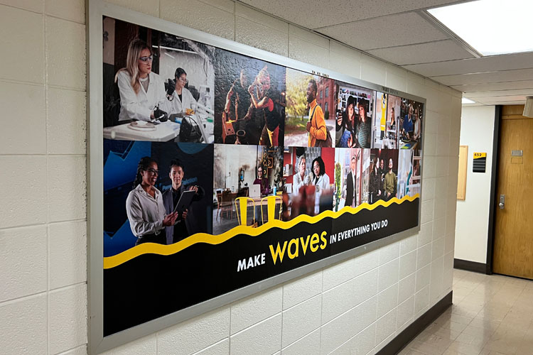 Bulletin board located in Marketing & Communications with updated brand campaign 