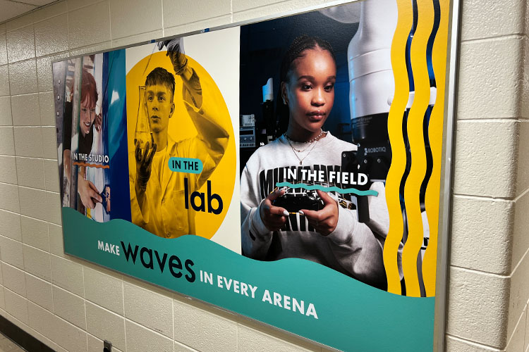 Bulletin board located in Marketing & Communications with updated brand campaign 