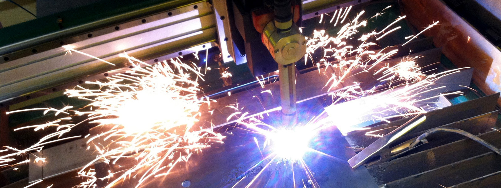 Image of a plasma cutter, while cutting, close-up