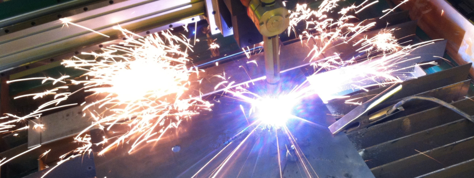 Image of our CNC plasma cutter while cutting through steel