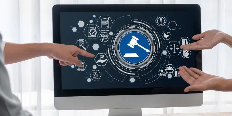 people pointing to a desktop monitor with government icons on it