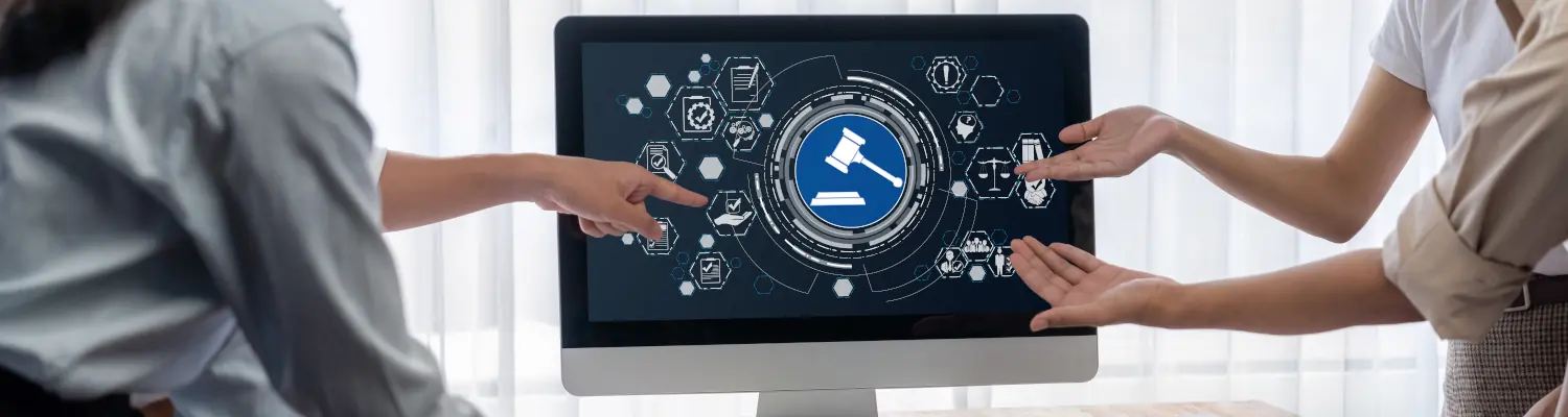 people pointing to a desktop monitor with government icons on it