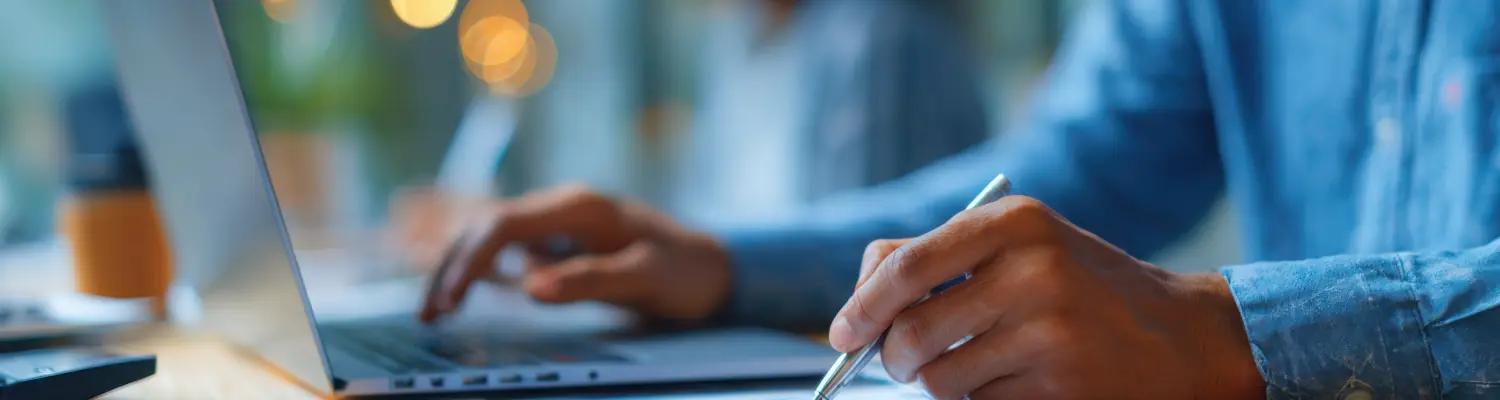 closeup of hands using a laptop