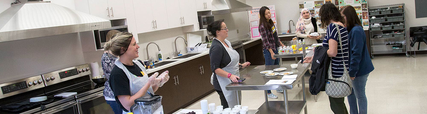 Students in nutritional science course working in a kitchen