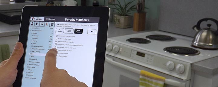 Photo of a user using HESTIA in a kitchen on an iPad
