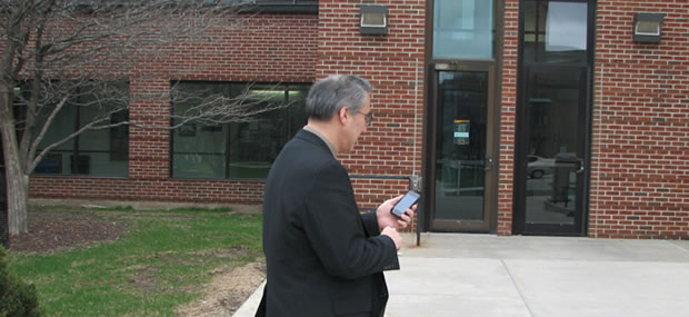 Photo of an individual using AR-B application on their phone